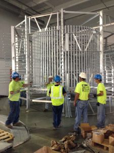 millwrights handling and assembling complex machinery.