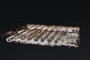 High-tech 3D scanner capturing detailed industrial facility layout for digital modeling